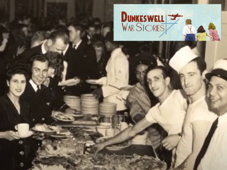 Dunkeswell War Stories - A black and white photo of a group of people at a 1940s dinner and dance.