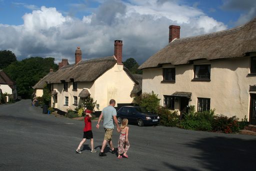 centre of Broadhembury photo with a man and two children crossing the road