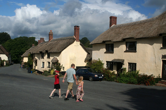 centre of Broadhembury photo with a man and two children crossing the road