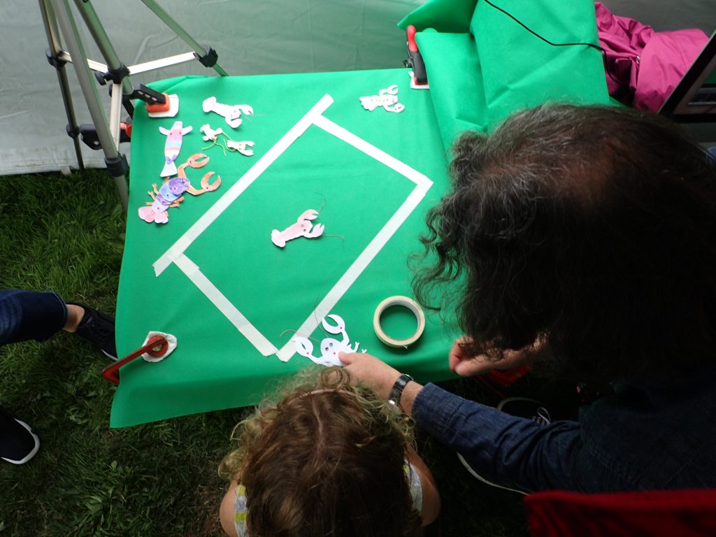 Cut out crayfish drawing placed on a 'green screen' to make stop-frame animation