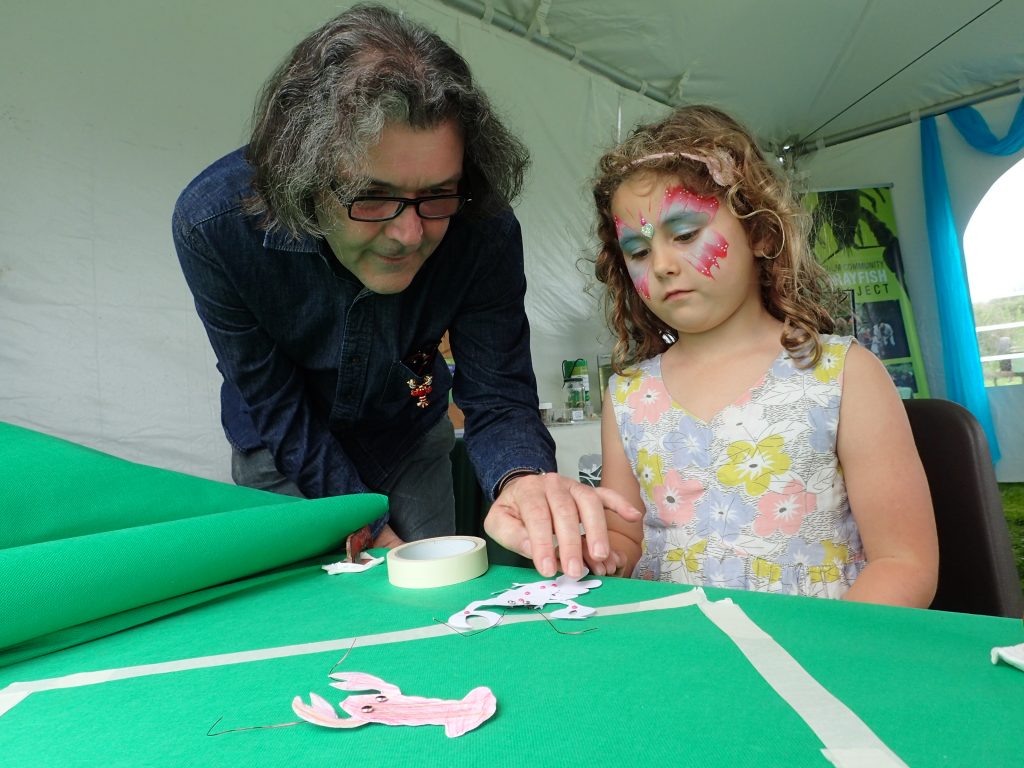 Cut out crayfish drawing placed on a 'green screen' to make stop-frame animation