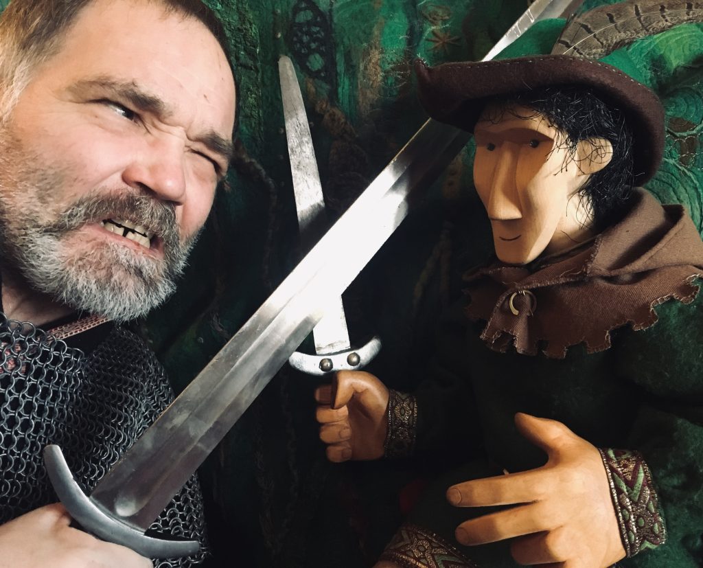 An actor and puppet with swords from the Stockand fair