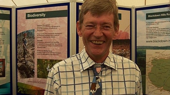 Paul standing in front of display boards at Honiton Show