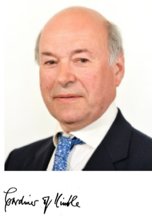 man in a black suit and blue tie