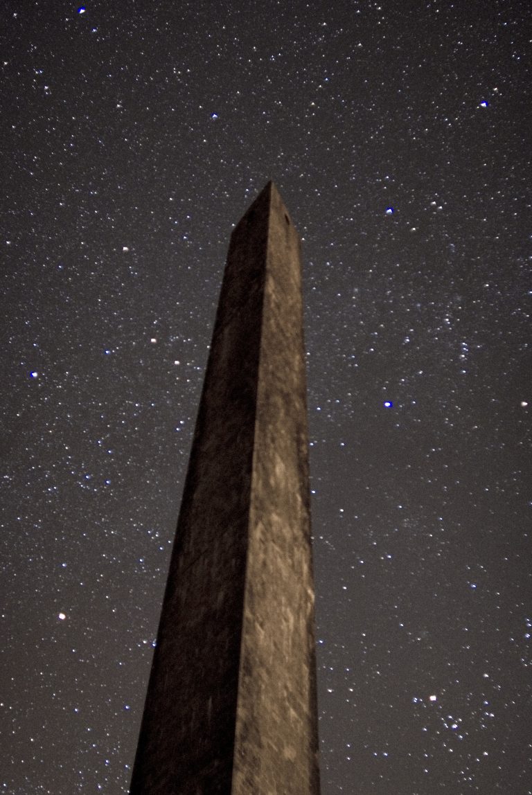 Wellington Monument at night with a star filled night sky